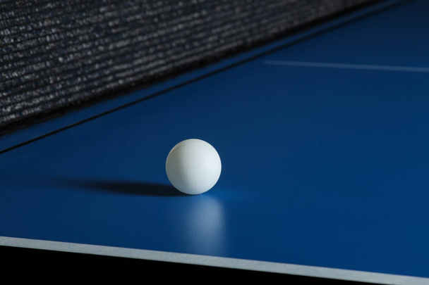 Ping-pong ball on a blue table tennis table. Sport. Sport game - Photo, Image