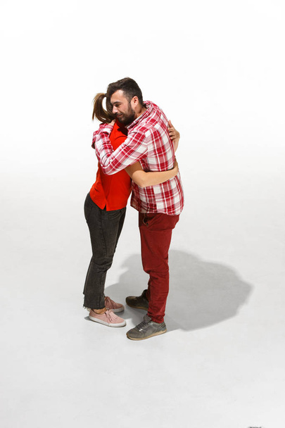 Full body portrait of hugging couple with smile. Caucasian models in love - Zdjęcie, obraz