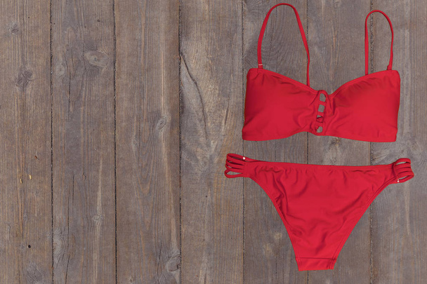 swimsuit on wooden background. top view - Foto, immagini