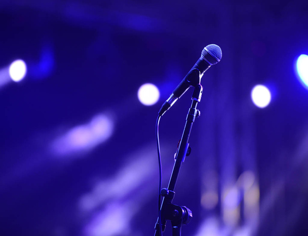 microphone on a rock concert, blue light show image - Foto, Imagen