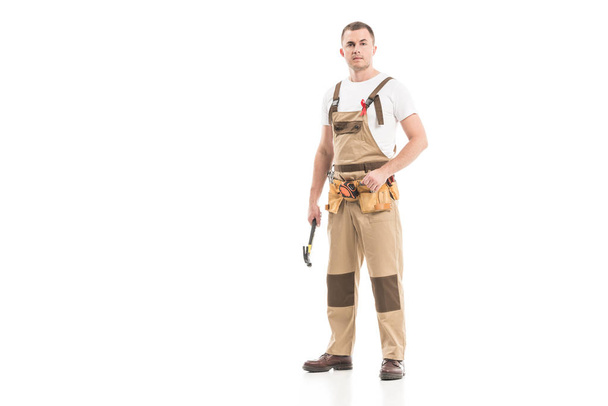 attractive adult builder with aids awareness red ribbon on overall isolated on white - Foto, immagini