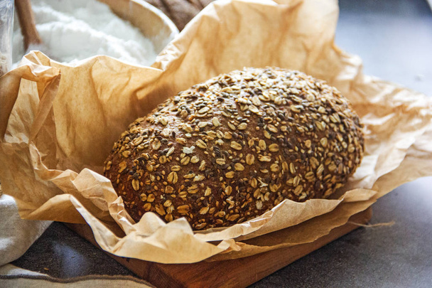 Multi-grain healthy bread on pergamet paper - Foto, afbeelding