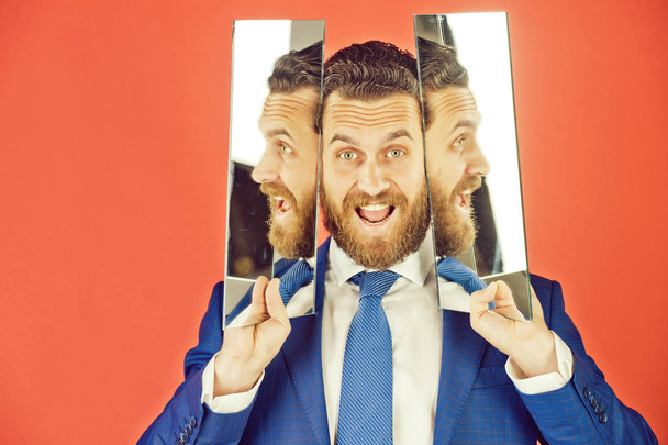 happy face of bearded hipster man, businessman reflecting in mirror - Foto, imagen