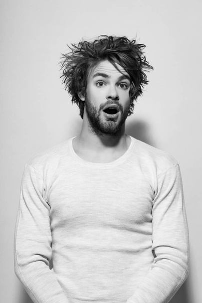 surprised man with long uncombed hair wake up in morning - Foto, Imagen