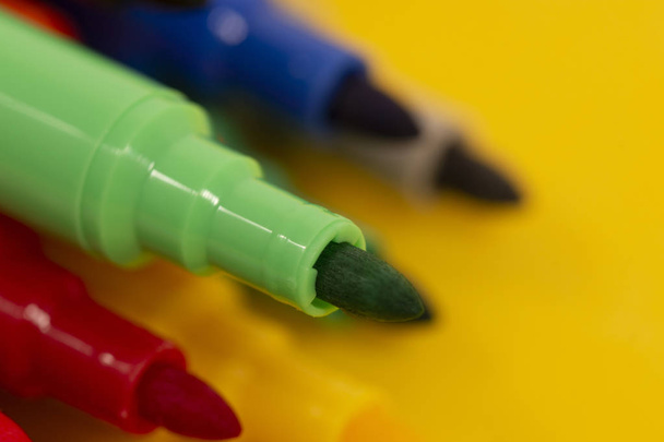 set of felt pens isolated on a yellow background. - Photo, Image