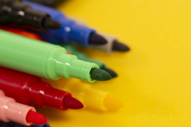 set of felt pens isolated on a yellow background. - Photo, Image