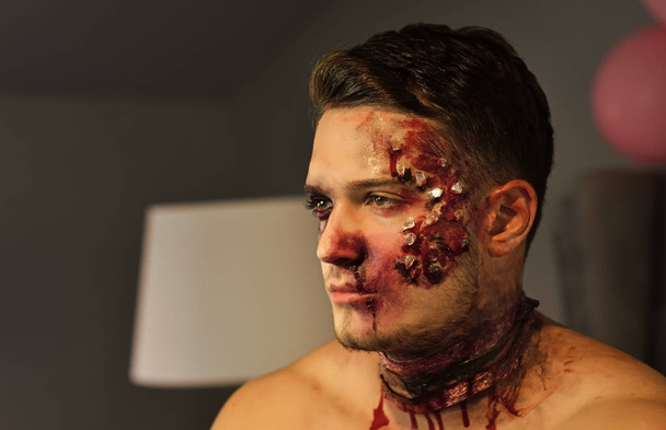 Halloween guy with blood and wounds - 写真・画像