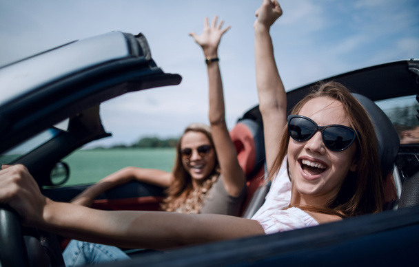 close up. happy woman driving a convertible. - 写真・画像