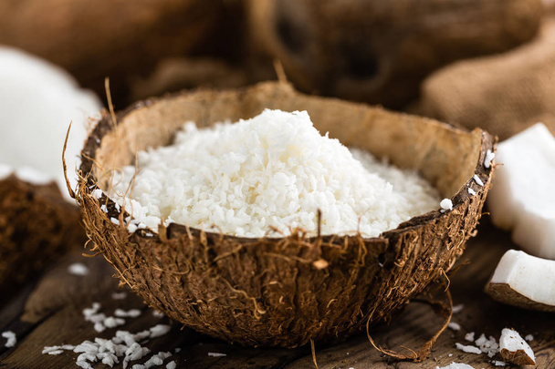 Coconut flakes in bowl - Photo, image