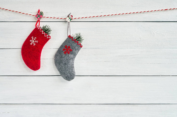 Colorful Christmas socks on white wooden background. Copy space. Christmas background - Fotografie, Obrázek