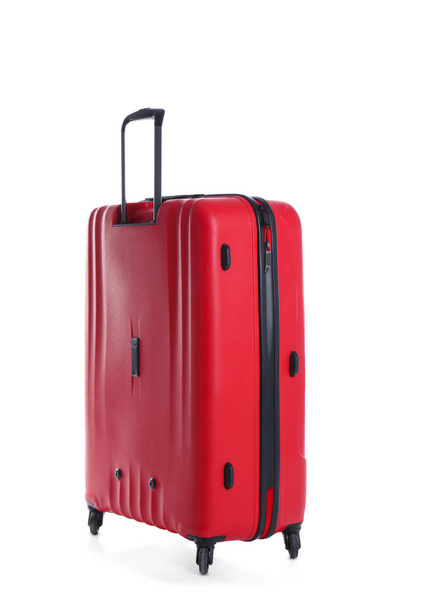 Red suitcase for travelling on white background - Foto, Imagen
