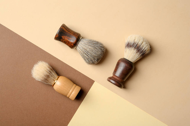 Flat lay composition with shaving brushes for men on color background - Valokuva, kuva