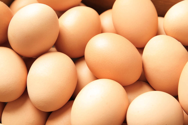 Pile of raw brown chicken eggs, closeup - Фото, изображение