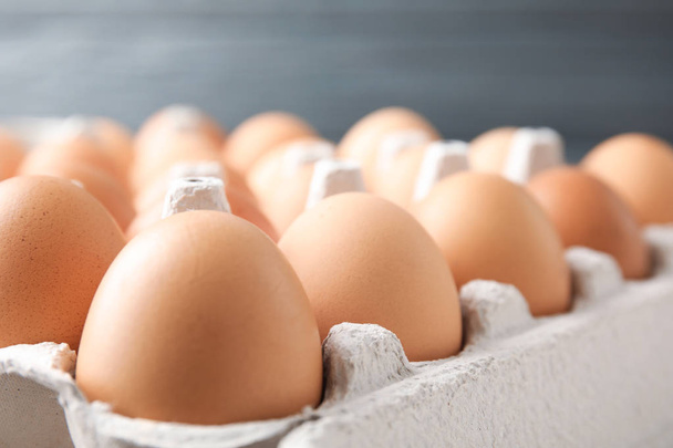 Raw chicken eggs in carton, closeup view - Zdjęcie, obraz