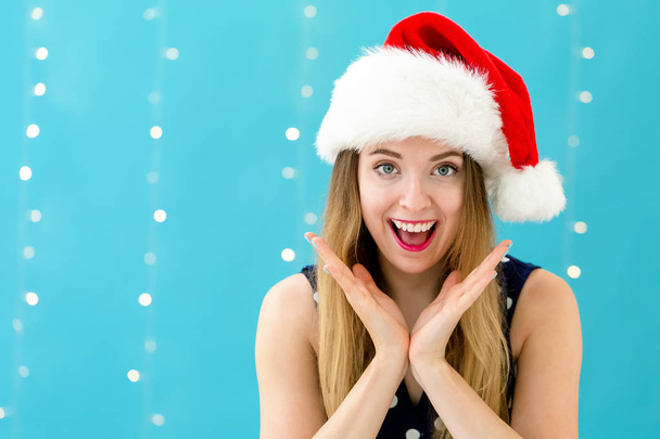 Happy woman with a Santa hat - Foto, Imagen
