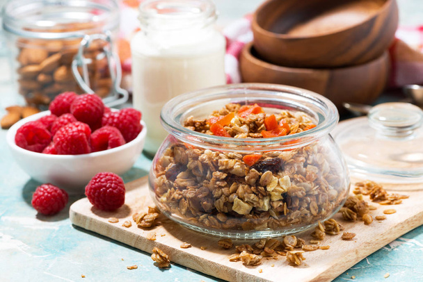 homemade granola with dried apricots and nuts for breakfast, closeup horizontal - Foto, Imagen