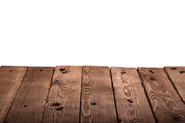 Ξύλινο τραπέζι που απομονώνονται σε λευκό φόντο. Ελεύθερο χώρο για το κείμενο - Φωτογραφία, εικόνα