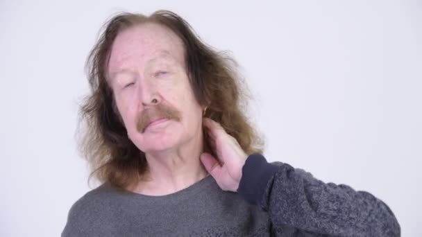 Stressed senior man having neck pain - Кадри, відео