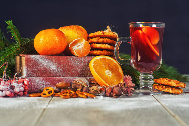 New year's hot mulled wine on a wooden table - Photo, Image