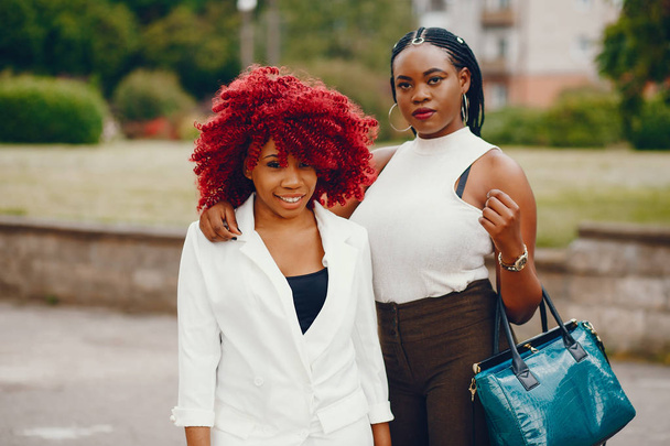 Black girls in a summer park - Φωτογραφία, εικόνα