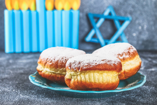 Jewish holiday Hanukkah and its attributes, menorah, donuts, Star of David. Hanukkah menorah. Hanukkah holiday. Jewish Hanukkah - Фото, зображення