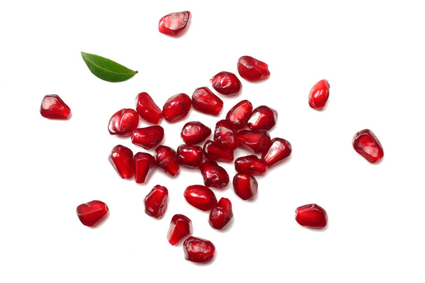 pomegranate seeds isolated on white background. top view. pomegranate berries. - Фото, изображение