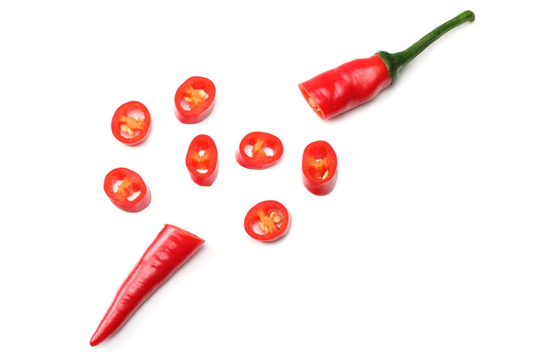 sliced red hot chili peppers isolated on white background top view - Фото, зображення