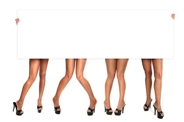 Womens Legs Holding up a Blank Sign - Foto, immagini