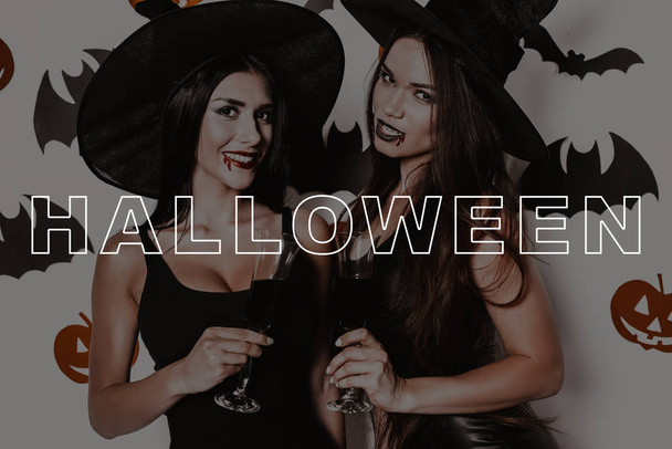 Glasses of Blood. Vampire. Black Dresses. Halloween. Party. Sexy. Witches. Laughs. Hats. Joyful. Confetti. Bats. Smile. Magic. Fun. Fashion. Pretty. Lady. Makeup. Wizard. Stylish. Gothic. Cosmetic. - 写真・画像
