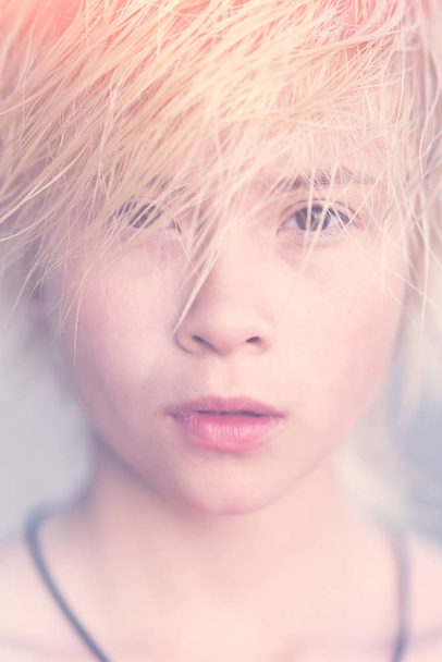 Face of girl blonde teenager. Toned - Fotoğraf, Görsel