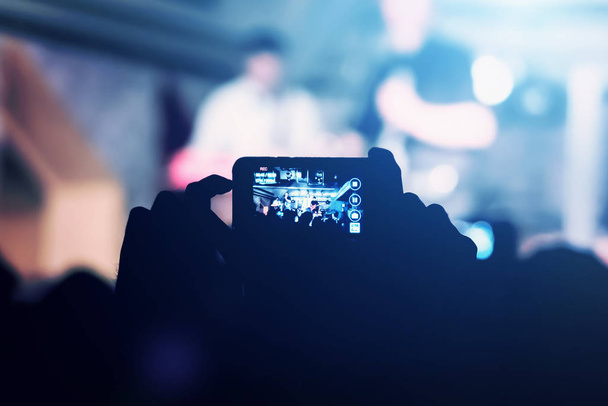 Man removes on the smartphone show in a nightclub - Fotografie, Obrázek