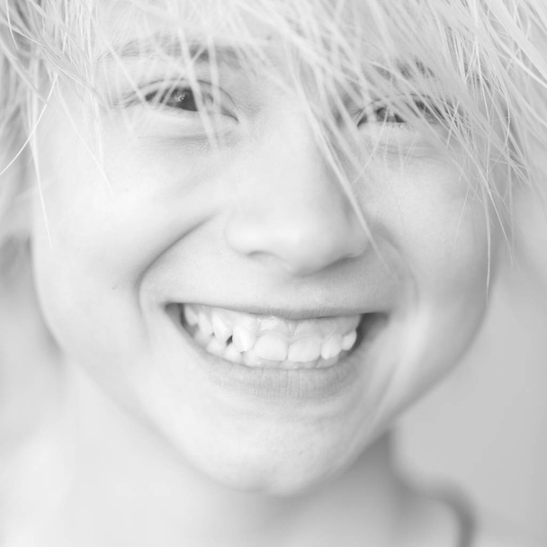 Face of girl blonde teenager with a smile, close-up. Toned - Fotoğraf, Görsel