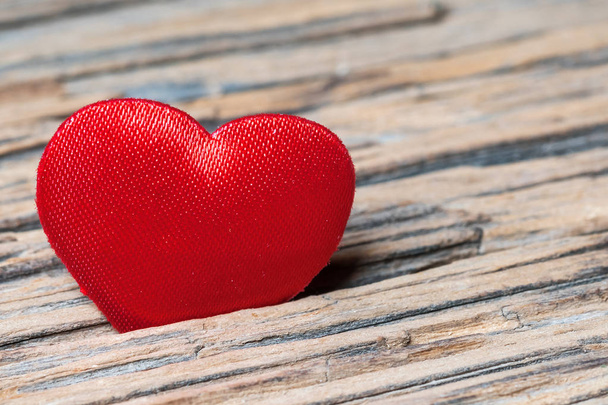 Red heart on old wooden surface - Fotografie, Obrázek