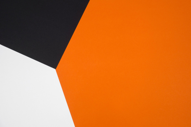 Black, orange and white color paper geometric flat lay background - Photo, Image