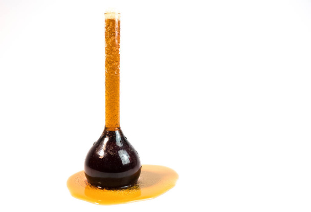 black sparkling liquid in a test tube, black sparkling drink - Foto, Imagem