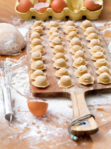 Ravioli homemade. Fresh dough and ravioli traditional to the rustic table. - Photo, Image