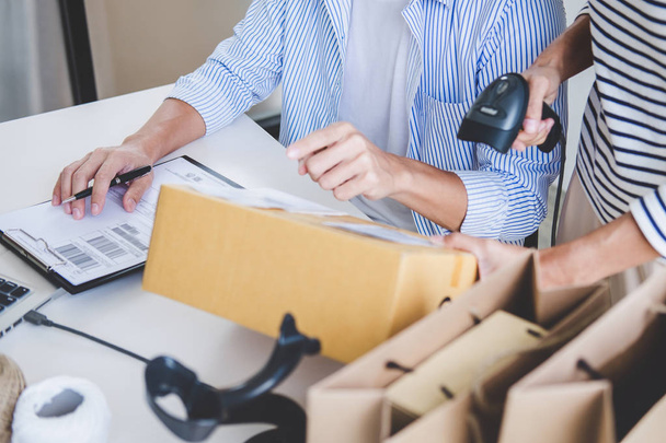 Shipment Online Sales, Small business or SME entrepreneur owner delivery service and working packing box, business owner working checking order to confirm before sending customer in post office. - Fotoğraf, Görsel