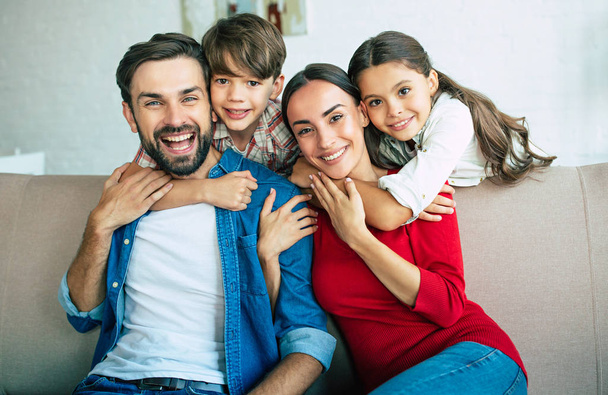 Young family spending happy time at home  - Foto, Imagen