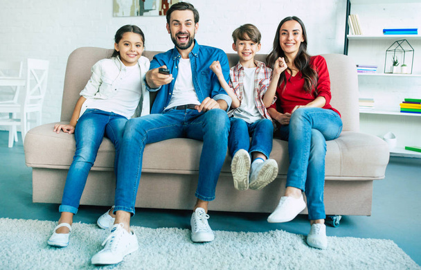 Young family spending happy time at home  - Foto, Bild