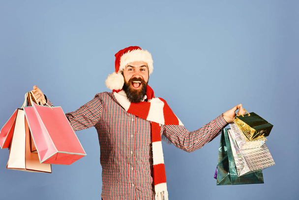 Santa with colorful packets. Christmas shopping and sale concept - Foto, Bild