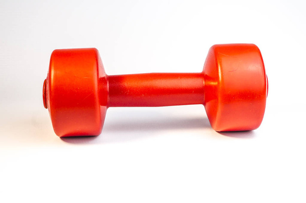 Close up view of red dumbbell on white background - Φωτογραφία, εικόνα