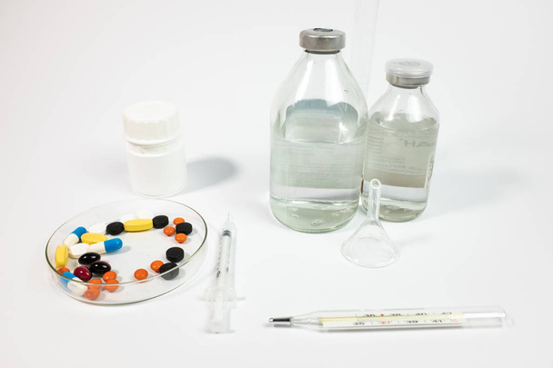 Variety medicines and syringe, isolated on white background  - Фото, зображення