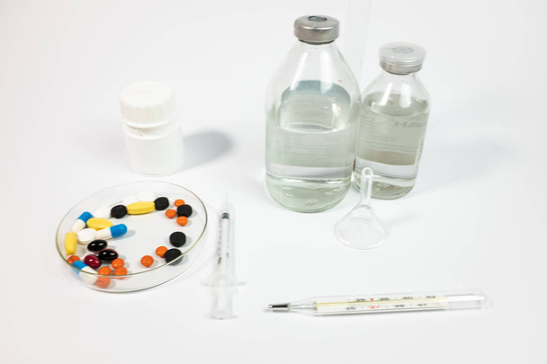 Variety medicines and syringe, isolated on white background  - Foto, Imagem