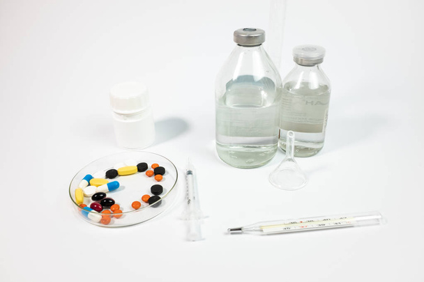 Variety medicines and syringe, isolated on white background  - Foto, Bild