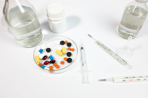 Variety medicines and syringe, isolated on white background  - Фото, зображення