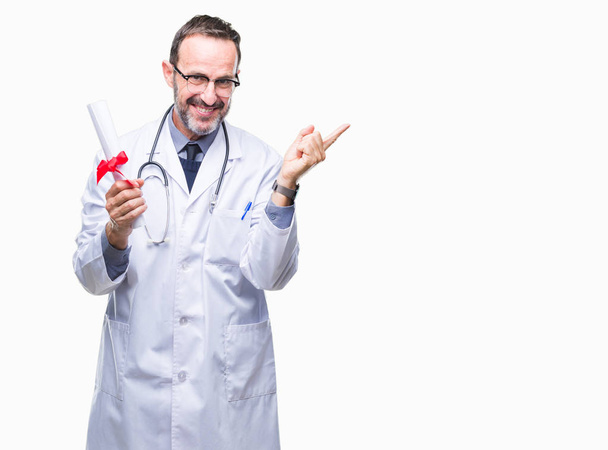 Middle age senior hoary doctor man holding degree certificate over isolated background very happy pointing with hand and finger to the side - Fotoğraf, Görsel