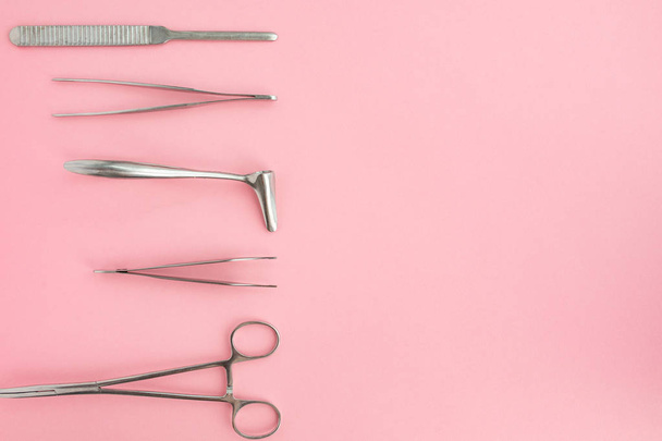 Flat lay of medical instruments on rose background. Mock up health care medical background. - Foto, afbeelding