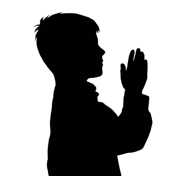 Векторний силует хлопчика, що молиться на білому тлі
. - Вектор, зображення