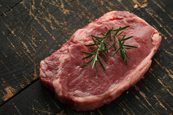 fresh slice of meat on wooden background - Foto, Imagen
