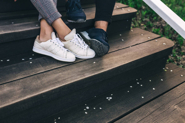 Crop legs of couple on steps - Photo, Image